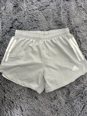 adidas Women's Light Gray Athletic Shorts with White Stripe Accents